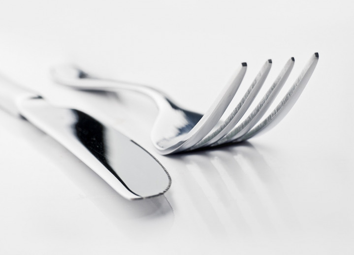 stainless steel cutlery set fork knife spoon on napkin